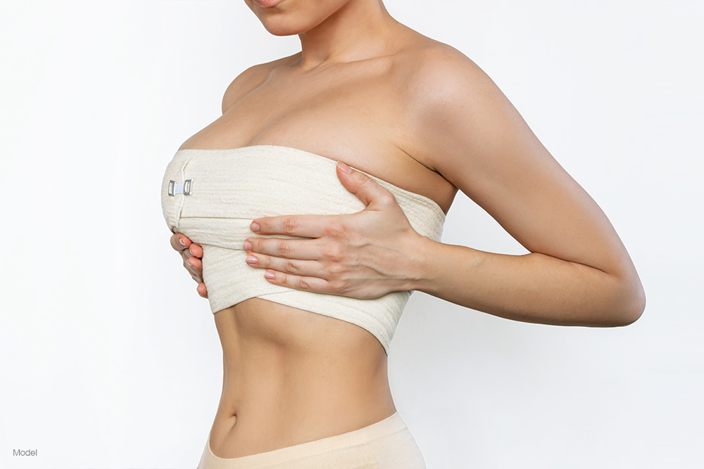 Woman with bandages over her breast